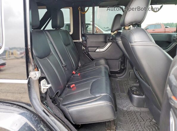 1C4BJWFG5GL179979 2016 JEEP WRANGLER Black Rear interior view