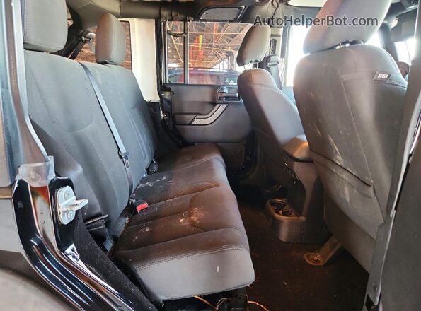 1C4HJWDG5GL235853 2016 JEEP WRANGLER Black Rear interior view