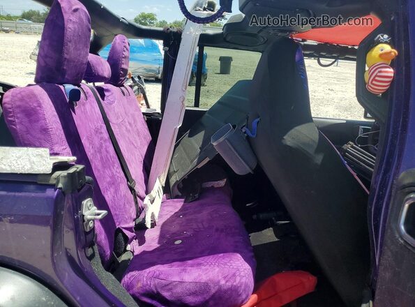 1C4HJXDG7PW577244 2023 JEEP WRANGLER Purple Vista de los asientos traseros