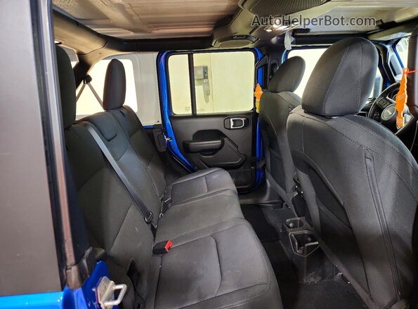 1C4HJXDN1PW643396 2023 JEEP WRANGLER Blue Rear interior view