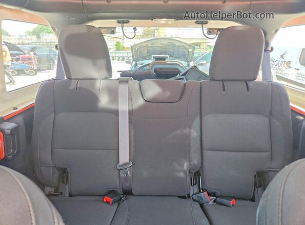 1C4HJXDN3PW679963 2023 JEEP WRANGLER Orange Rear seats view