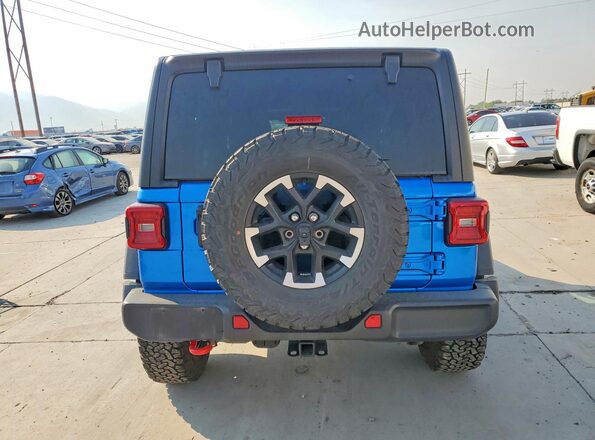 1C4PJXFG8TW213899 2026 JEEP WRANGLER Blue Вид ззаду