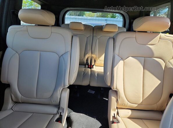 1C4RJKBGXS8744915 2025 JEEP GRAND Burgundy Rear seats view