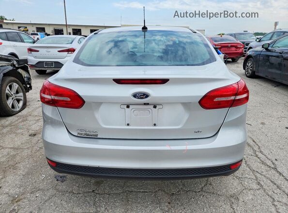 1FADP3F21JL268505 2018 FORD FOCUS Silver Rear view