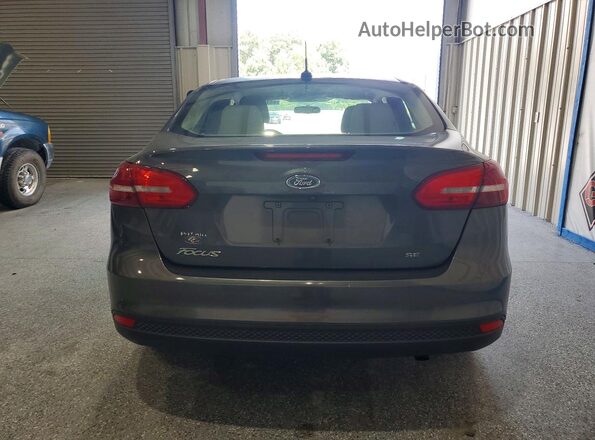 1FADP3F22HL274548 2017 FORD FOCUS Серый Вид сзади