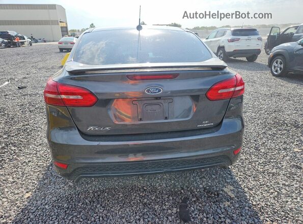 1FADP3F25GL379549 2016 FORD FOCUS Серый Вид сзади