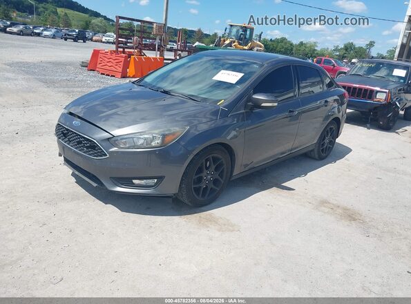 1FADP3F28GL390111 2016 FORD FOCUS Gray Vista tres cuartos delantera izquierda