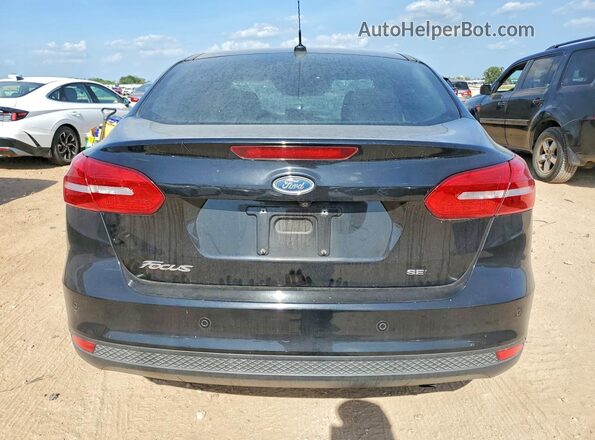 1FADP3H21JL222802 2018 FORD FOCUS Black Widok z tyłu