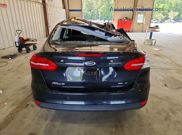 1FADP3H23JL314204 2018 FORD FOCUS Black Rear view