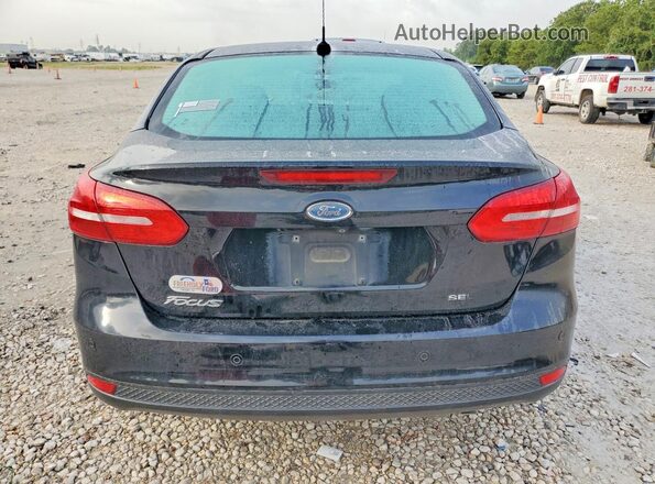 1FADP3H2XJL321439 2018 FORD FOCUS Black Rear view