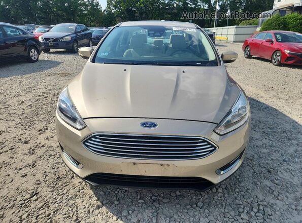 1FADP3J21HL321902 2017 FORD FOCUS Желто-коричневый Вид спереди