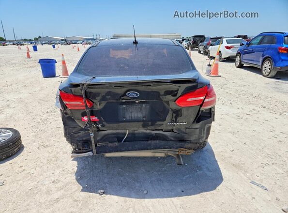 1FADP3J27JL294307 2018 FORD FOCUS Black Rear view
