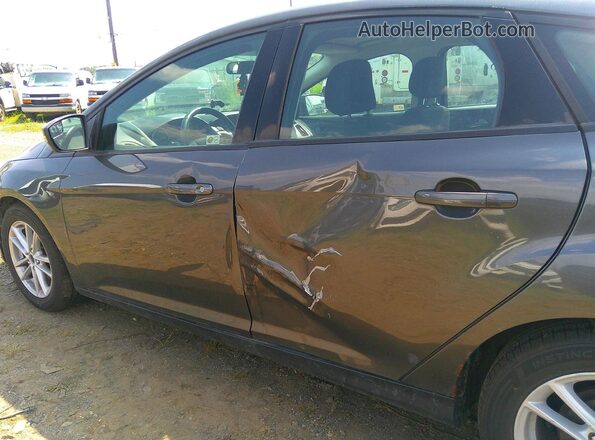 1FADP3K25JL263765 2018 FORD FOCUS Black VIN կոդի պիտակի տեսք