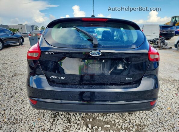 1FADP3M28JL265863 2018 FORD FOCUS Black Rear view