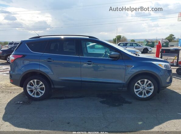 1FMCU0GD4JUC03392 2018 FORD ESCAPE Blue Vista interior trasera