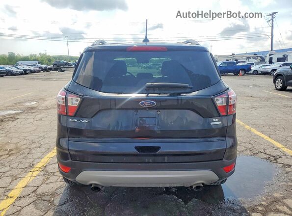 1FMCU0GD7JUB10253 2018 FORD ESCAPE Black Rear view