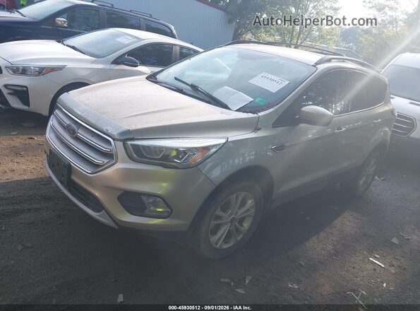 1FMCU0GD8HUE87104 2017 FORD ESCAPE Gold Vista tres cuartos delantera izquierda