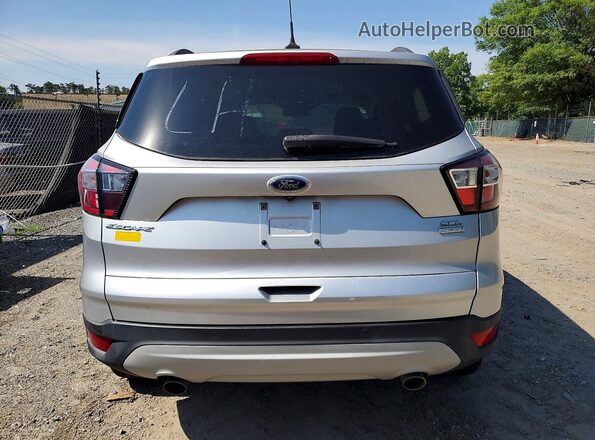 1FMCU0HD8JUD14719 2018 FORD ESCAPE Silver Rear view