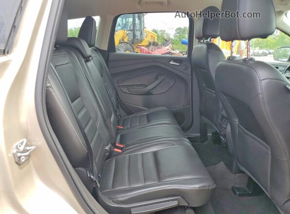 1FMCU0JD8HUC64358 2017 FORD ESCAPE Gold Rear interior view