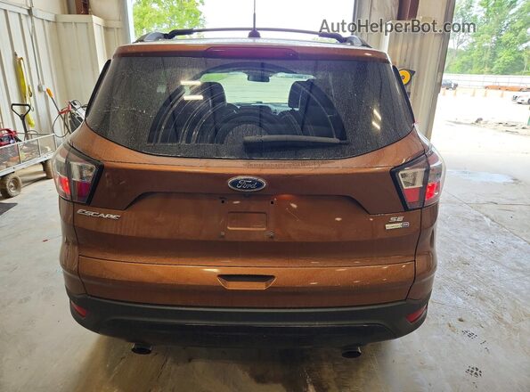 1FMCU9G99HUE68058 2017 FORD ESCAPE Gold Հետևի տեսք