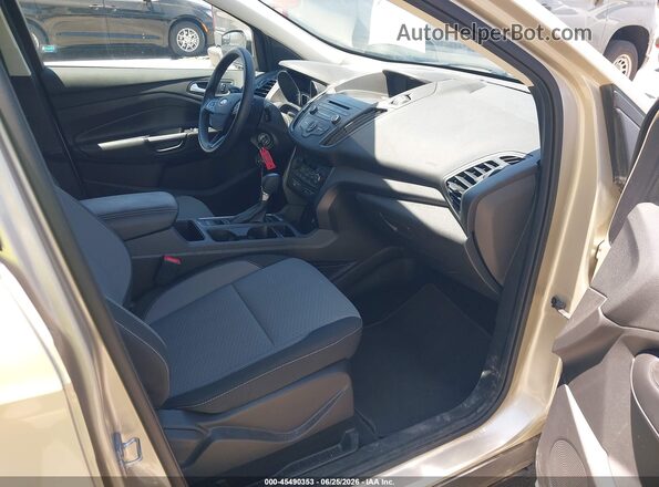 1FMCU9GD4HUE18513 2017 FORD ESCAPE Gold Front interior view
