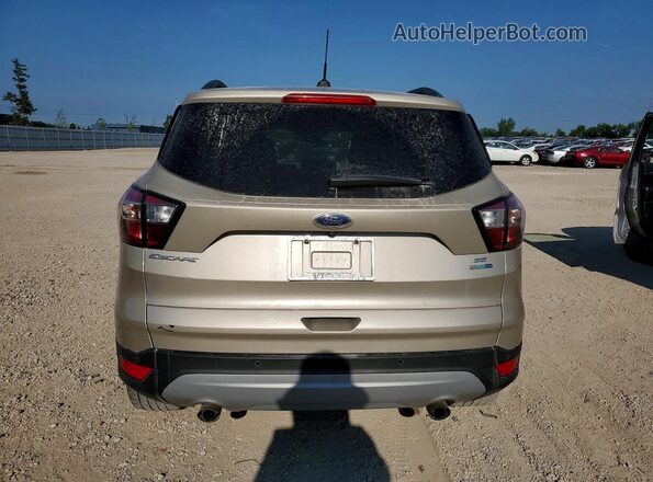 1FMCU9GD8HUE34066 2017 FORD ESCAPE Gold Rear view