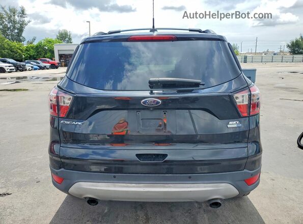 1FMCU9HD4JUD53666 2018 FORD ESCAPE Black Rear view
