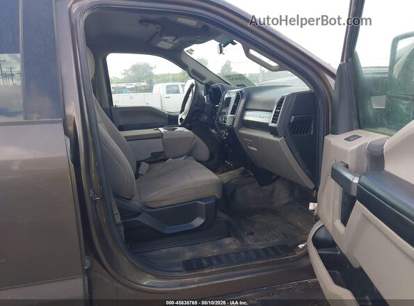 1FT7W2B61HEE02246 2017 FORD F-250 Коричневый Вид салона спереди