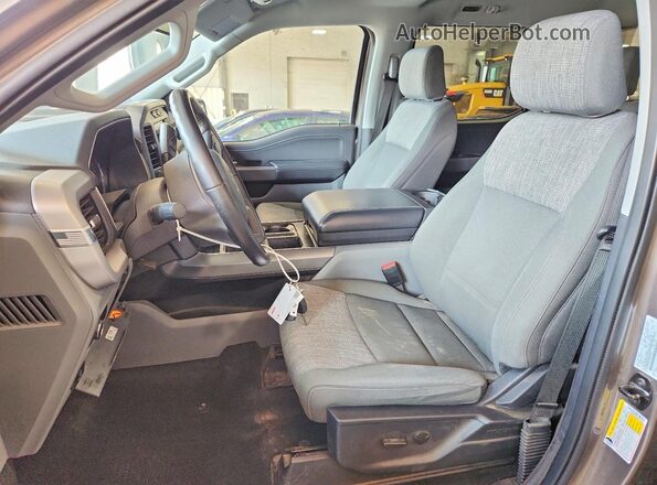 1FTFW1E81PFA77223 2023 FORD F150 Tan Вид салону спереду