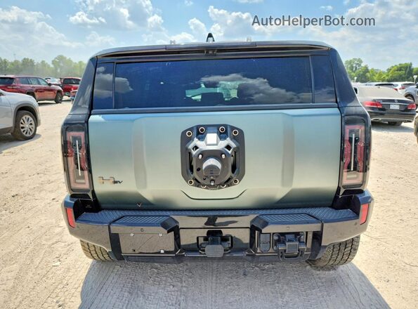 1GKB0RDC7RU100379 2024 GMC HUMMER Gray უკანა ხედი