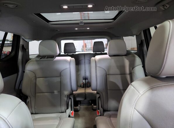 1GKKNMLS7PZ183292 2023 GMC ACADIA White Widok tylnych siedzeń