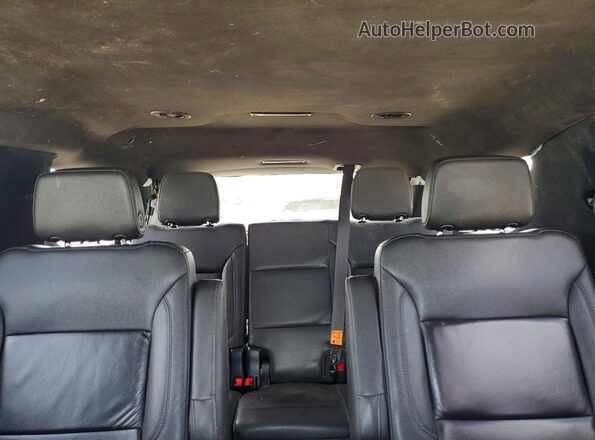 1GNSCNKD4PR222390 2023 CHEVROLET TAHOE Silver Rear seats view