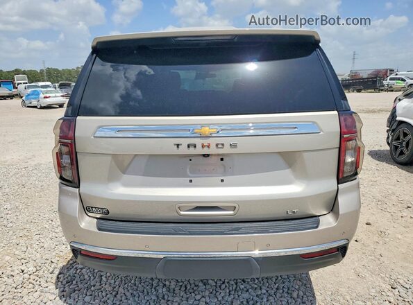 1GNSCNKD4PR222390 2023 CHEVROLET TAHOE Silver Rear view