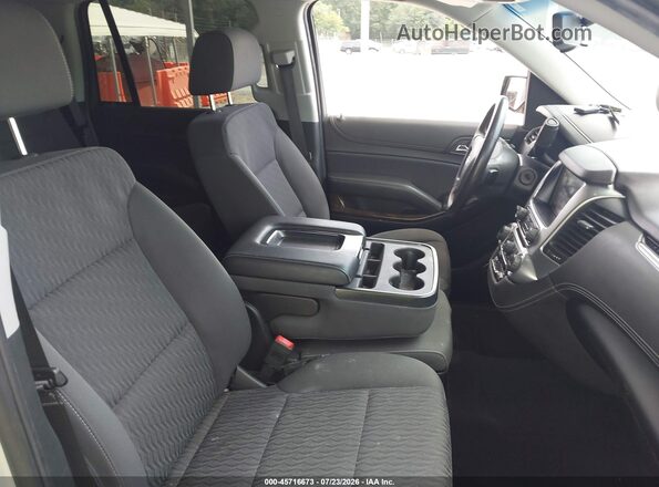 1GNSKAEC1KR348357 2019 CHEVROLET TAHOE Серебряный Вид салона спереди