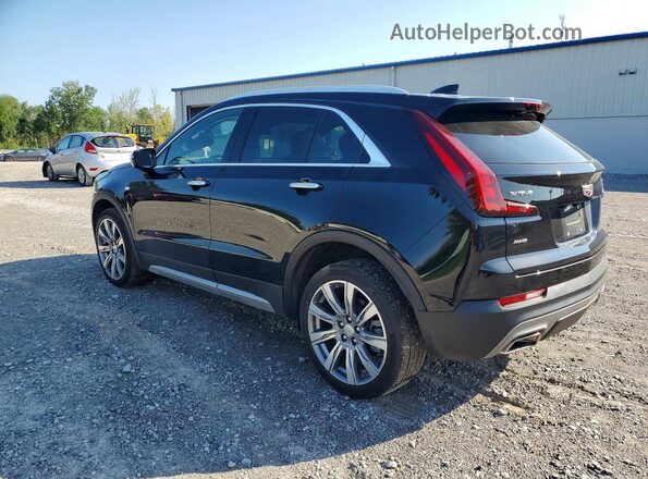 1GYFZDR42PF221520 2023 CADILLAC XT4 Black Trasero izquierdo