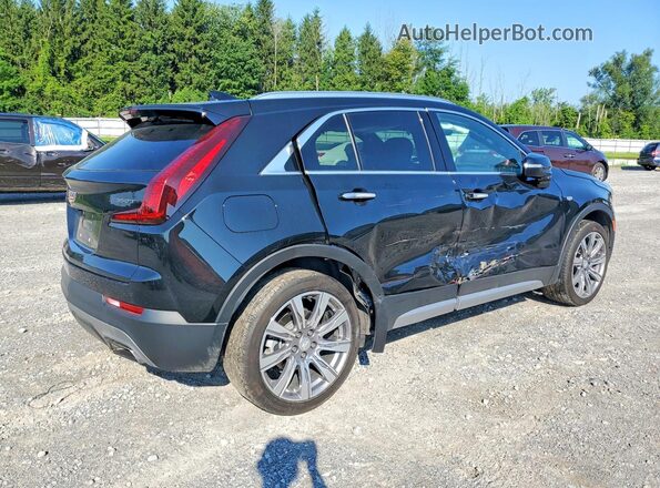 1GYFZDR42PF221520 2023 CADILLAC XT4 Black Trasero derecho