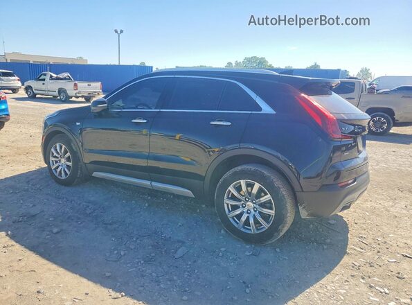 1GYFZDR4XPF101786 2023 CADILLAC XT4 Black Trasero izquierdo