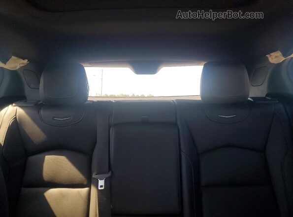 1GYFZDR4XPF101786 2023 CADILLAC XT4 Black Vista de los asientos traseros