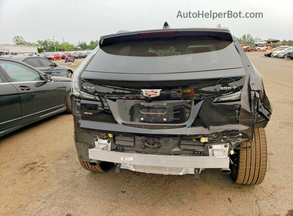 1GYFZFR43RF127015 2024 CADILLAC XT4 Black Rear view