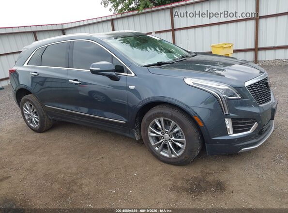 1GYKNDR40MZ150239 2021 CADILLAC XT5 Blue Սալոնի 360 աստիճան տեսք