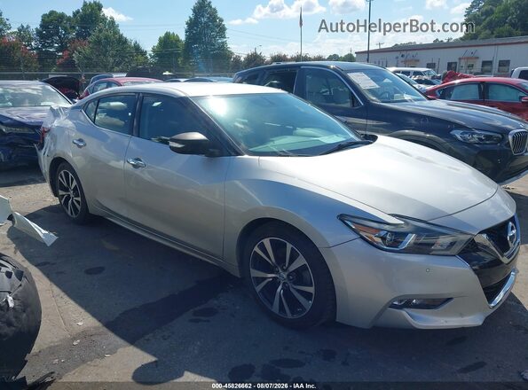 1N4AA6AP4JC387738 2018 NISSAN MAXIMA Серебряный Вид задней части салона