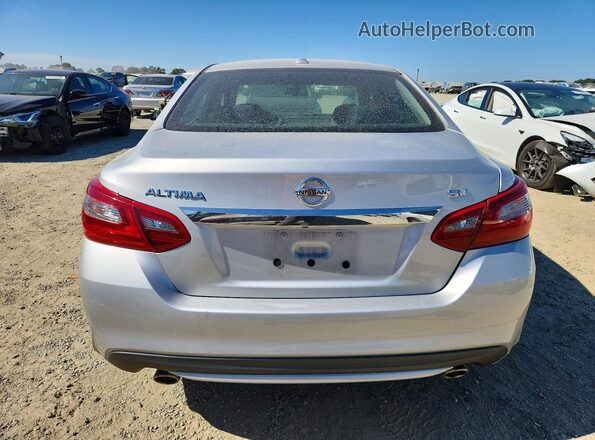 1N4AL3AP4JC179027 2018 NISSAN ALTIMA Silver Вид ззаду