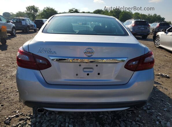 1N4AL3AP9JC281584 2018 NISSAN ALTIMA Silver Vista interior delantera