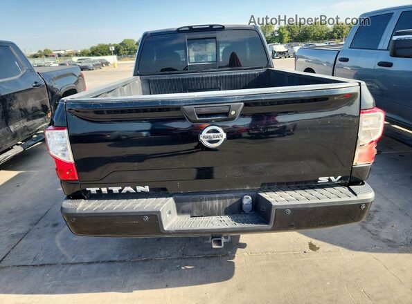1N6AA1C66JN511012 2018 NISSAN TITAN Black Widok wnętrza z tyłu