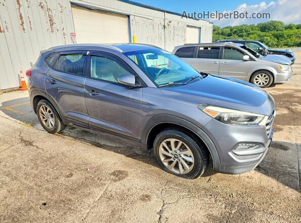 KM8J3CA26GU050249 2016 HYUNDAI TUCSON Gray წინა ხედი