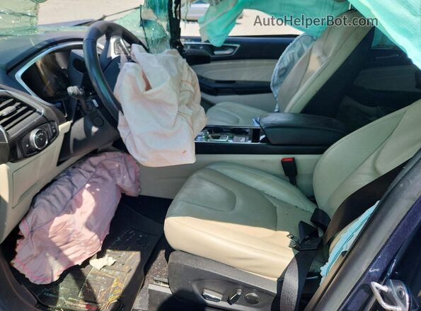 2FMPK3K98KBC75960 2019 FORD EDGE Blue Vista interior delantera