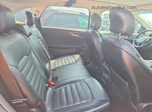2FMPK4J82HBB61556 2017 FORD EDGE Black Սալոնի հետևի տեսք