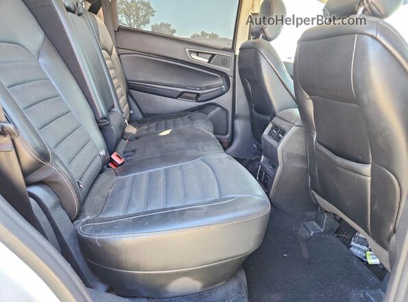 2FMPK4J85HBC10264 2017 FORD EDGE White Rear seats view