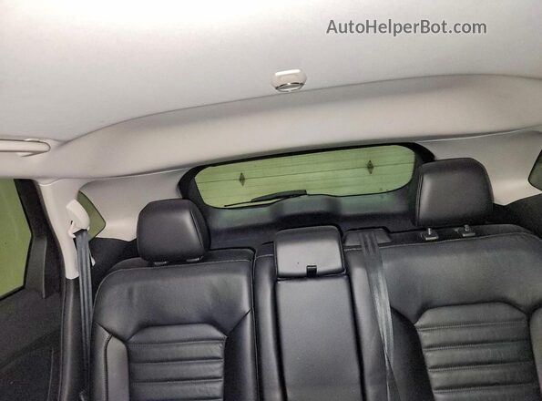 2FMPK4J95GBB89486 2016 FORD EDGE Blue Vista de los asientos traseros