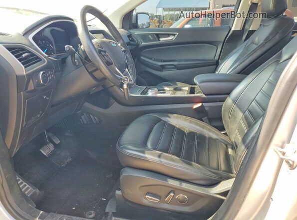 2FMPK4J97KBC74774 2019 FORD EDGE Серебряный Вид салона спереди